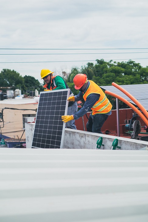 Solar panel worker installing